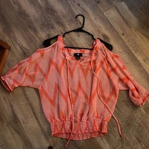Coral, sheer top with open shoulders